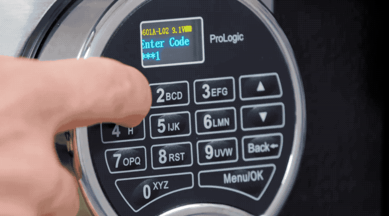 an animated GIF showing a default 1-1-1-1-1-1 code being punched into a digital safe, and then someone opening the safe door.