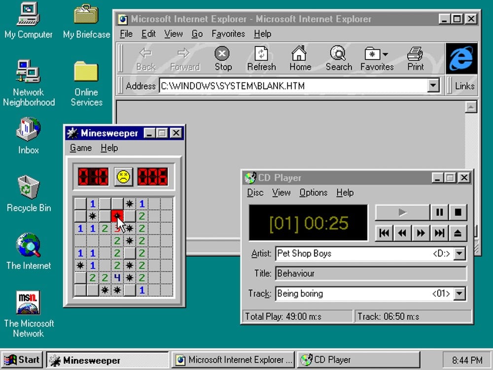 a screenshot of Windows 95, featuring a start menu, a teal background, and Internet Explorer so old that it's collecting dust. 