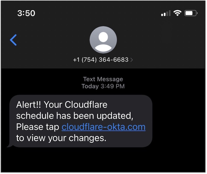 A screenshot of an iPhone with a SMS phish with a URL to a phishing page designed to capture credentials and two-factor codes. 
