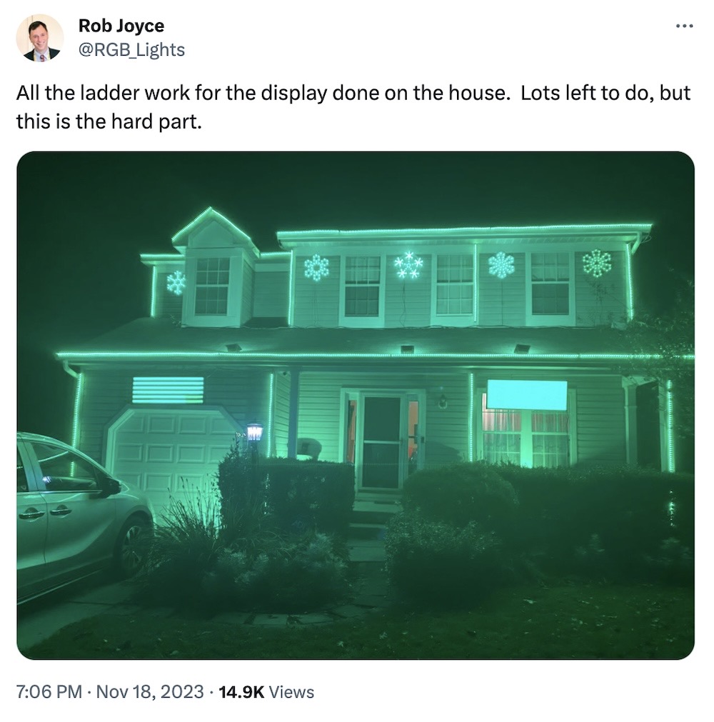 Rob Joyce tweet: "All the ladder work for the display done on the house. Lots left to do, but this is the hard part," followed by a photo of his house lit up all green with a ton of strip lights and lit-up holiday decorations.