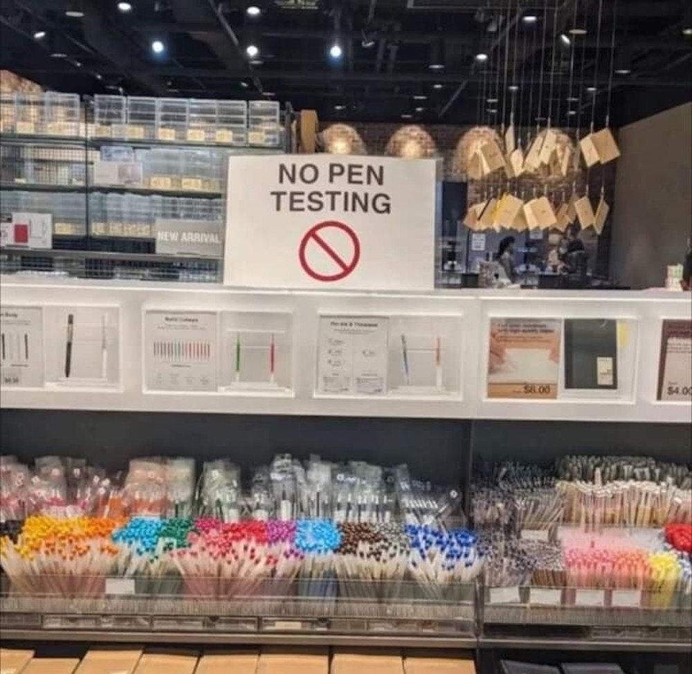 A photo of a pen display, with a sign that says, "No pen testing."