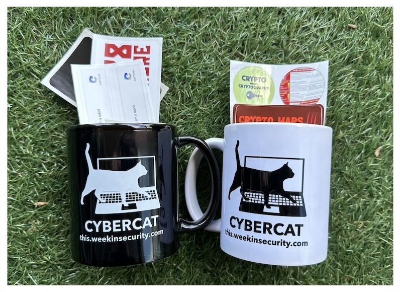 A selection of stickers in two mugs featuring cyber cats, one black mug and one white mug, on a green grassy background.