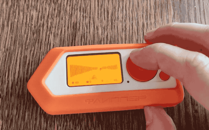 A short animated GIF showing Doom running on the small orange display of the Flipper Zero hacking device.