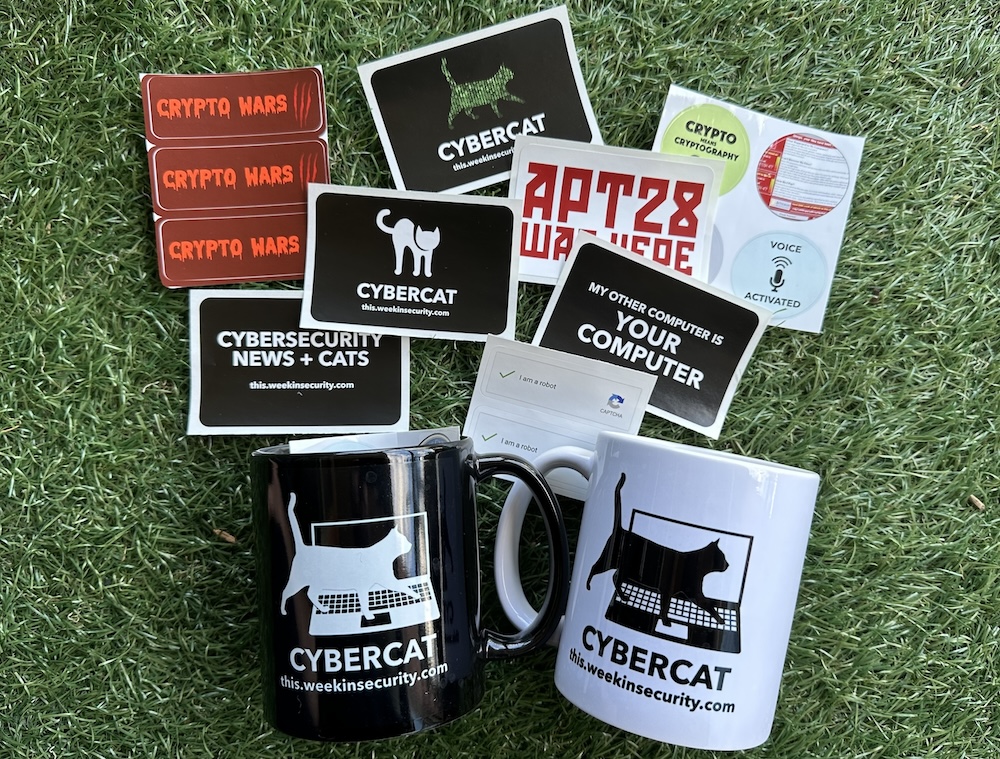 A selection of cyber cat and security-themedn stickers, and a this week in security mug (each in both black and white mug colors).