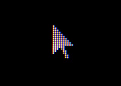 a close up photo of a cursor on a display and black background, shown as very pixelated. 