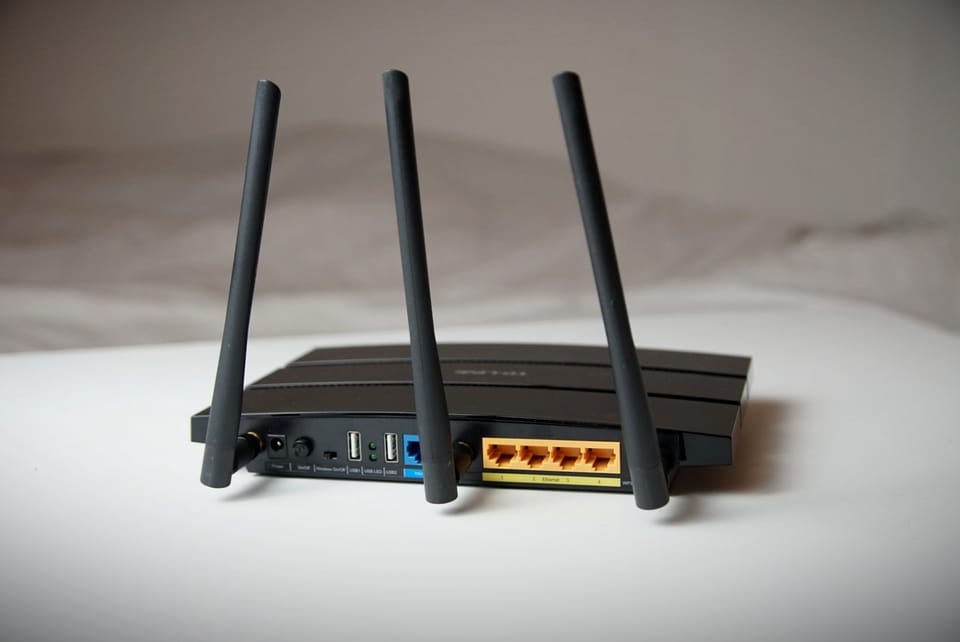a photo of the back of a TP-Link wireless router